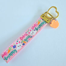 Load image into Gallery viewer, Some Bunny Loves You with Glitter Flowers & Carrots on Gold Key Chain Fob includes Enameled Bunny Charm