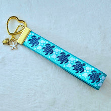 Load image into Gallery viewer, Glittery Sea Turtles Honu on Gold Key Chain Fob with Turtle & Pearl or Starfish Charm