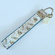 Load image into Gallery viewer, Bunnies with Carrots on White Heart Key Fob Wristlet on Silver or Rainbow