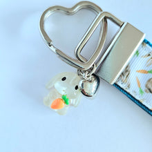 Load image into Gallery viewer, Bunnies with Carrots on White Heart Key Fob Wristlet on Silver or Rainbow