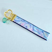 Load image into Gallery viewer, Dolphins in Watercolor Pink Blue Waters on Yellow Gold Key Chain Fob with Dolphin Charm