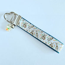Load image into Gallery viewer, Bunnies with Carrots on White Heart Key Fob Wristlet on Silver or Rainbow