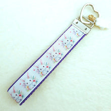 Load image into Gallery viewer, Watercolor Floral White Bun with Bunny and Flower Charms