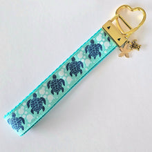 Load image into Gallery viewer, Glittery Sea Turtles Honu on Gold Key Chain Fob with Turtle & Pearl or Starfish Charm