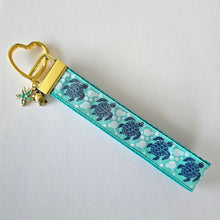 Load image into Gallery viewer, Glittery Sea Turtles Honu on Gold Key Chain Fob with Turtle & Pearl or Starfish Charm