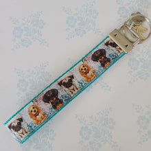 Load image into Gallery viewer, Dog Portraits Cocker Spaniel, Doberman, Pug Key Fob , Dog Key Chain with Enameled Paw Print Charm