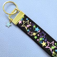 Load image into Gallery viewer, Stars on Black with Glitter on Gold Key Chain Fob with Enameled Star cmCharm