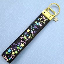 Load image into Gallery viewer, Stars on Black with Glitter on Gold Key Chain Fob with Enameled Star cmCharm