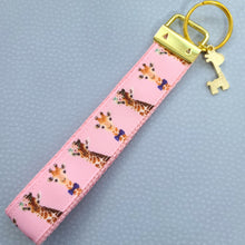 Load image into Gallery viewer, Giraffes on Pink Key Chain Fob with Enameled Giraffe charm