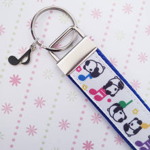 Load image into Gallery viewer, Pandas Sitting on Notes Key Chain Fob with Enameled Note Charm