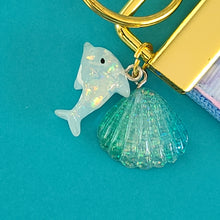 Load image into Gallery viewer, Dolphins in Watercolor Pink Blue Waters on Yellow Gold Key Chain Fob  with Dolphin Charm
