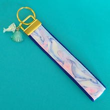Load image into Gallery viewer, Dolphins in Watercolor Pink Blue Waters on Yellow Gold Key Chain Fob  with Dolphin Charm
