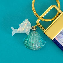 Load image into Gallery viewer, Dolphins in Watercolor Pink Blue Waters on Yellow Gold Key Chain Fob  with Dolphin Charm
