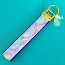 Load image into Gallery viewer, Dolphins in Watercolor Pink Blue Waters on Yellow Gold Key Chain Fob  with Dolphin Charm
