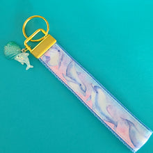 Load image into Gallery viewer, Dolphins in Watercolor Pink Blue Waters on Yellow Gold Key Chain Fob  with Dolphin Charm
