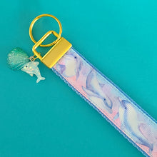 Load image into Gallery viewer, Dolphins in Watercolor Pink Blue Waters on Yellow Gold Key Chain Fob  with Dolphin Charm
