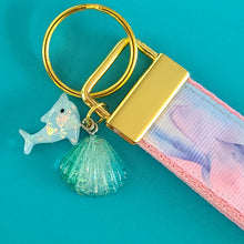 Load image into Gallery viewer, Dolphins in Watercolor Pink Blue Waters on Yellow Gold Key Chain Fob  with Dolphin Charm
