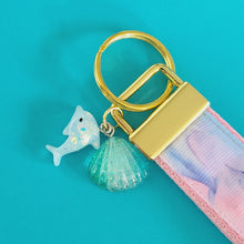 Load image into Gallery viewer, Dolphins in Watercolor Pink Blue Waters on Yellow Gold Key Chain Fob  with Dolphin Charm
