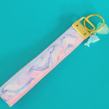 Load image into Gallery viewer, Dolphins in Watercolor Pink Blue Waters on Yellow Gold Key Chain Fob  with Dolphin Charm
