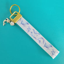 Load image into Gallery viewer, Dolphins in Watercolor on Yellow Gold Key Chain Fob with Gold Dolphin Charm
