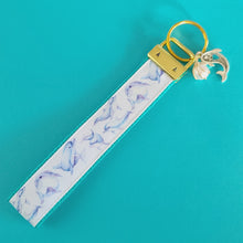 Load image into Gallery viewer, Dolphins in Watercolor on Yellow Gold Key Chain Fob with Gold Dolphin Charm
