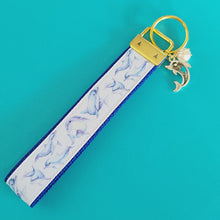 Load image into Gallery viewer, Dolphins in Watercolor on Yellow Gold Key Chain Fob with Gold Dolphin Charm
