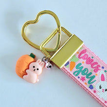 Load image into Gallery viewer, Some Bunny Loves You with Glitter Flowers &amp; Carrots on Gold Key Chain Fob includes Enameled Bunny Charm
