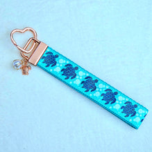 Load image into Gallery viewer, Glittery Sea Turtles Honu on Gold Key Chain Fob with Turtle &amp; Pearl or Starfish Charm
