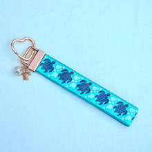 Load image into Gallery viewer, Glittery Sea Turtles Honu on Gold Key Chain Fob with Turtle &amp; Pearl or Starfish Charm
