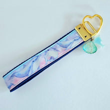 Load image into Gallery viewer, Dolphins in Watercolor Pink Blue Waters on Yellow Gold Key Chain Fob  with Dolphin Charm
