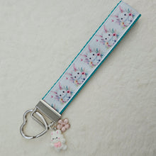 Load image into Gallery viewer, Watercolor Floral White Bun with Bunny and Flower Charms
