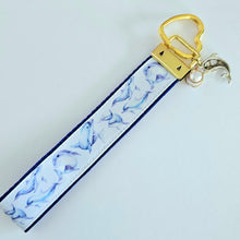 Load image into Gallery viewer, Dolphins in Watercolor on Yellow Gold Key Chain Fob with Gold Dolphin Charm
