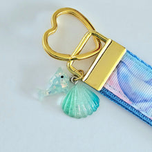Load image into Gallery viewer, Dolphins in Watercolor Pink Blue Waters on Yellow Gold Key Chain Fob  with Dolphin Charm
