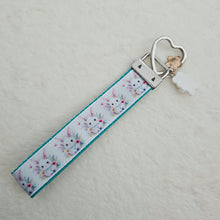 Load image into Gallery viewer, Watercolor Floral White Bun with Bunny and Flower Charms
