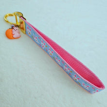 Load image into Gallery viewer, Bunnies with Carrots &amp; Flowers on Light Blue Yellow Gold Key Chain Fob with Enameled Bunny Charm
