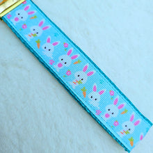 Load image into Gallery viewer, Bunnies with Carrots &amp; Flowers on Light Blue Yellow Gold Key Chain Fob with Enameled Bunny Charm
