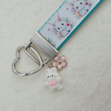Load image into Gallery viewer, Watercolor Floral White Bun with Bunny and Flower Charms
