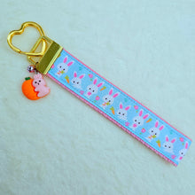 Load image into Gallery viewer, Bunnies with Carrots &amp; Flowers on Light Blue Yellow Gold Key Chain Fob with Enameled Bunny Charm
