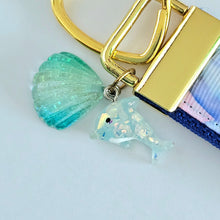 Load image into Gallery viewer, Dolphins in Watercolor Pink Blue Waters on Yellow Gold Key Chain Fob  with Dolphin Charm
