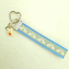 Load image into Gallery viewer, Bunnies In Love on Blue Keychain Fob with Cute Bunny Charm
