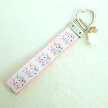 Load image into Gallery viewer, Watercolor Floral White Bun with Bunny and Flower Charms
