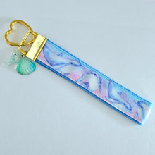 Load image into Gallery viewer, Dolphins in Watercolor Pink Blue Waters on Yellow Gold Key Chain Fob  with Dolphin Charm

