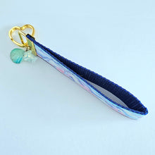 Load image into Gallery viewer, Dolphins in Watercolor Pink Blue Waters on Yellow Gold Key Chain Fob  with Dolphin Charm
