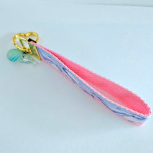 Load image into Gallery viewer, Dolphins in Watercolor Pink Blue Waters on Yellow Gold Key Chain Fob  with Dolphin Charm
