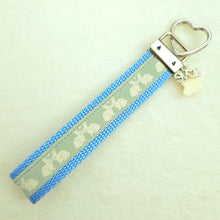Load image into Gallery viewer, Bunnies In Love on Blue Keychain Fob with Cute Bunny Charm
