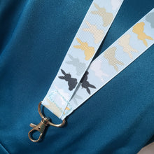 Load image into Gallery viewer, Bunny Shadows on Light Blue Lanyard with Silver Clasp
