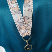 Load image into Gallery viewer, Bunnies Saying Hi! Lanyard with Silver Heart Clasp
