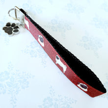 Load image into Gallery viewer, Pugs and Swirls Key Fob with Enameled Paw Print Charm
