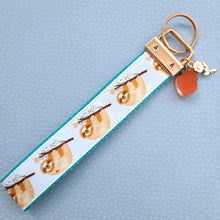 Load image into Gallery viewer, Sloths and Flowers Key Chain Fob with Strawberry and Leaf Charm
