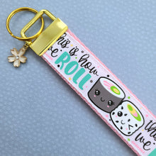 Load image into Gallery viewer, Sushi &quot;This is How I Roll&quot; Gold Key Chain Fob with Enameled Sakura Charm
